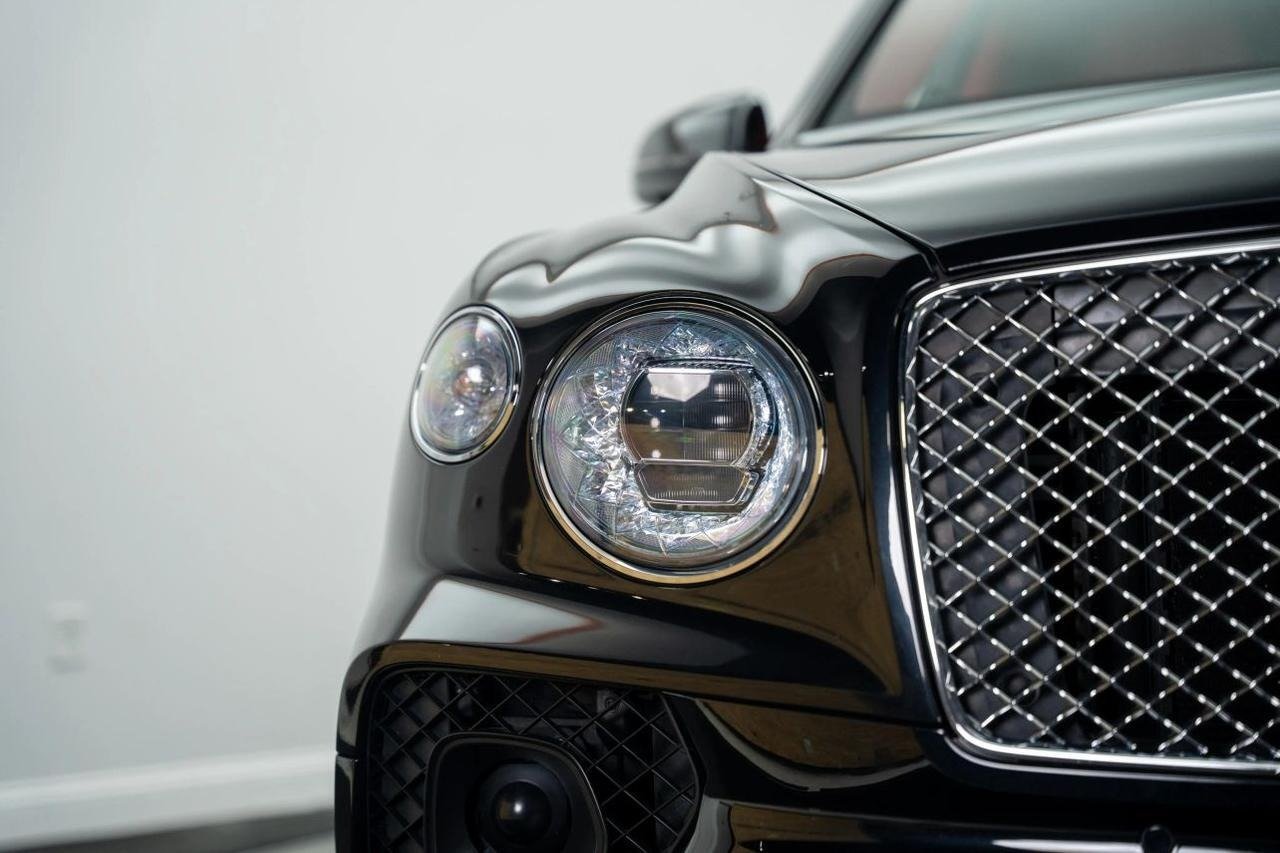 Exotic performance car showroom interior showcasing pre-owned sports vehicles
